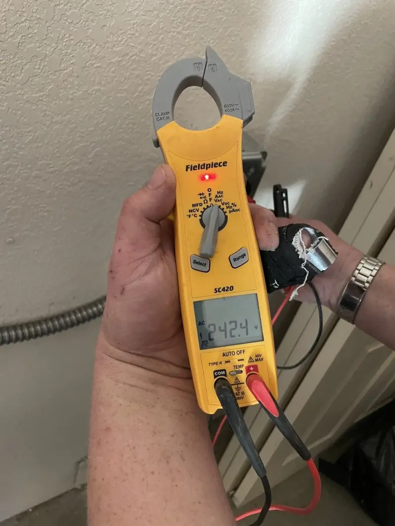 Voltage testing with clamp meter during Whole House Surge Protector in Corning